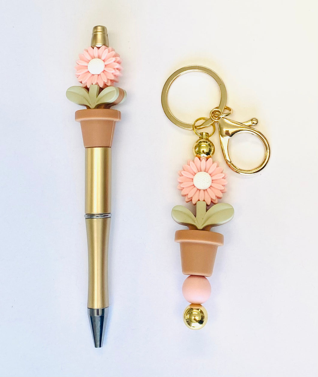 Ensemble porte-clés et stylo marguerite rose
