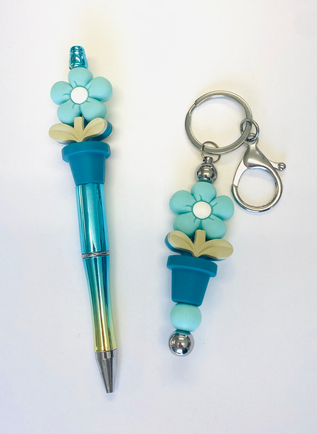 Ensemble porte-clés et stylo fleur turquoise