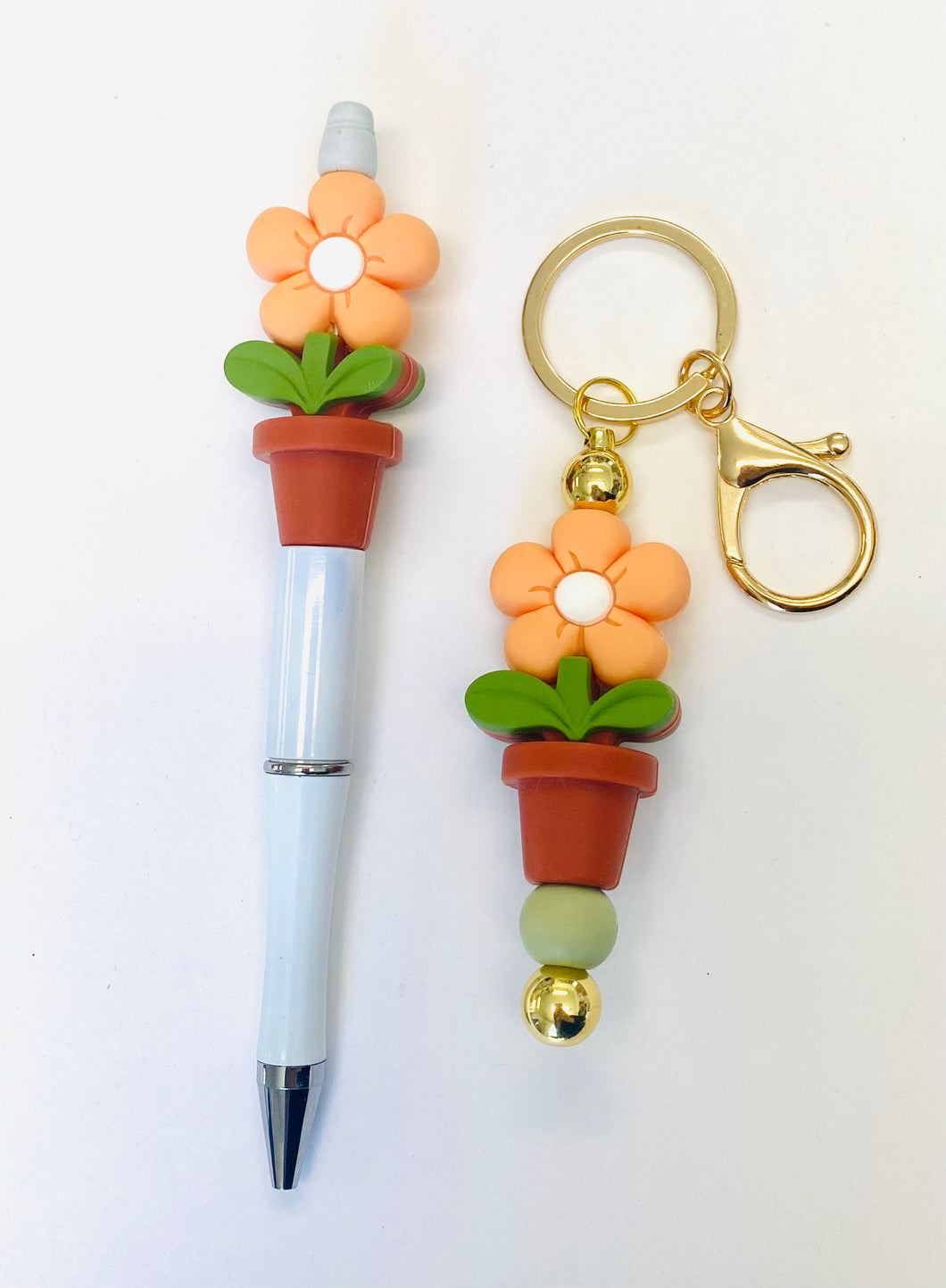 Ensemble porte-clés et stylo fleur pêche